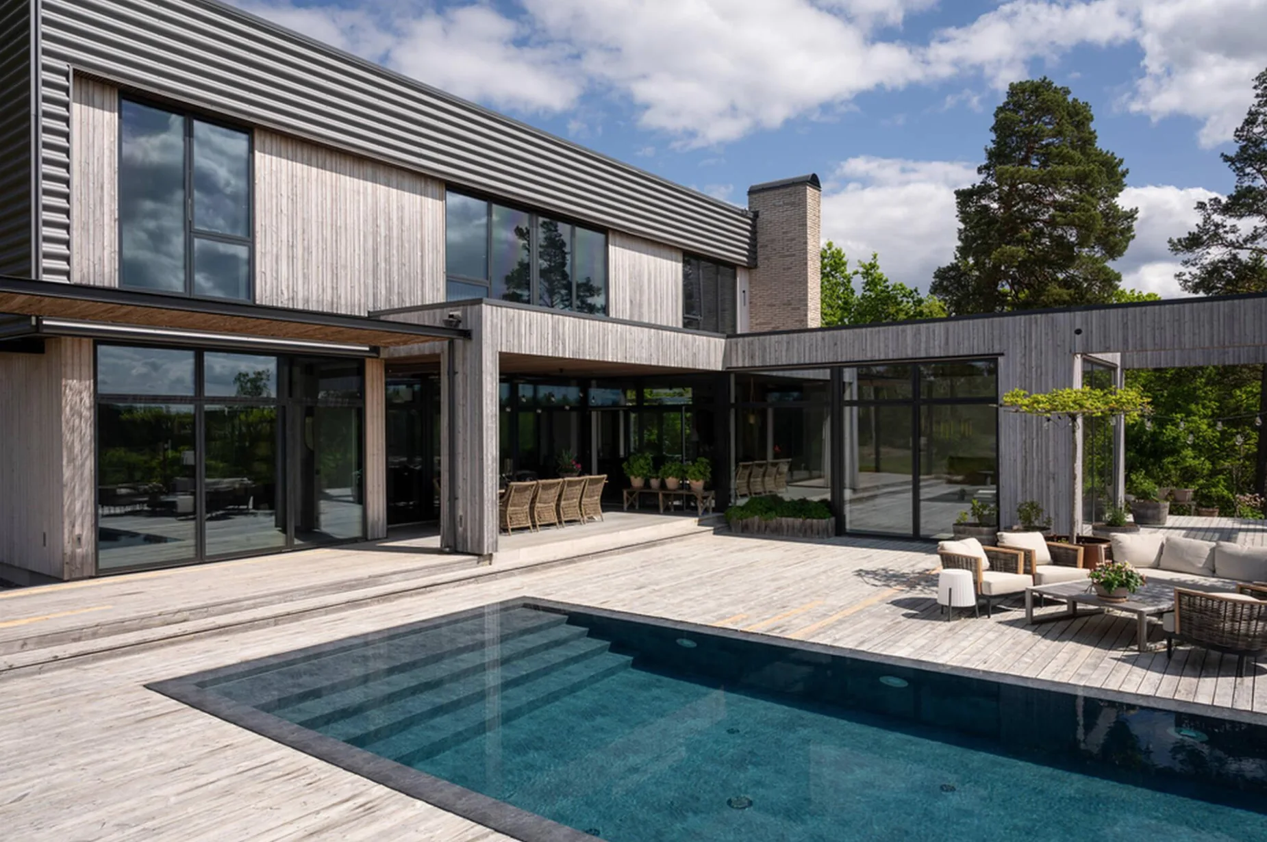 A Pahlén pool by a modern timber house
